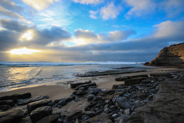 istock Amazing sunset in a beach with clouds in the sky. golden hour 860977248