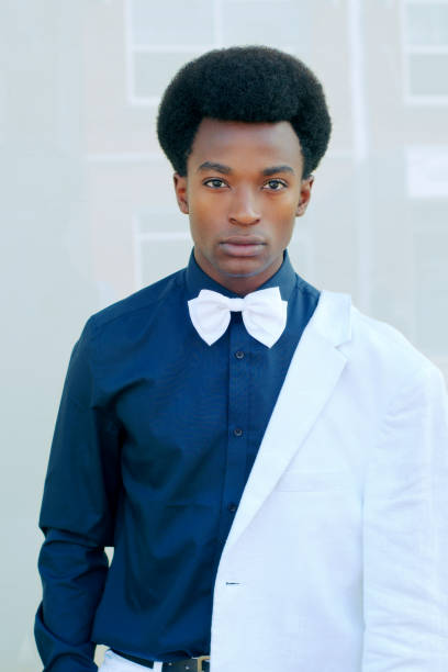 young man bow tie portrait white suit dark shirt - haute couture beautiful smoking beauty imagens e fotografias de stock