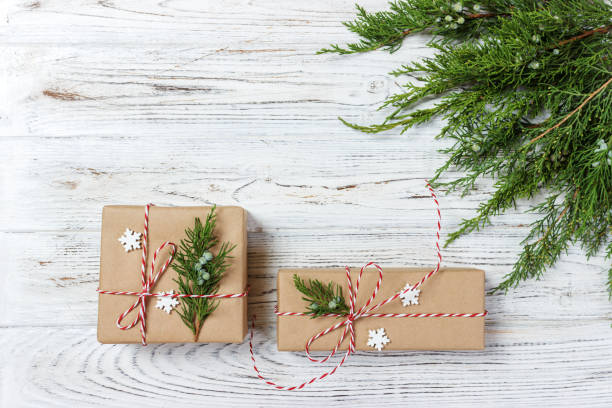 istock Classy Christmas gifts box presents on brown paper 860984248