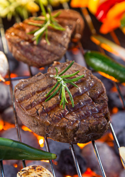 istock Delicious beef meat with vegetable on a barbecue grill 860986156