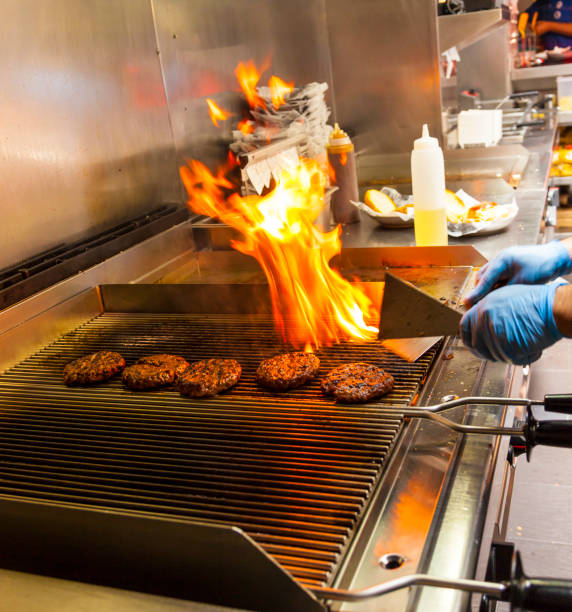 istock Hamburgers on a grill 860991542