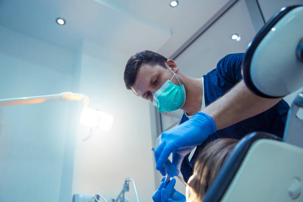 istock Little girl having regular dental check-up 860991842