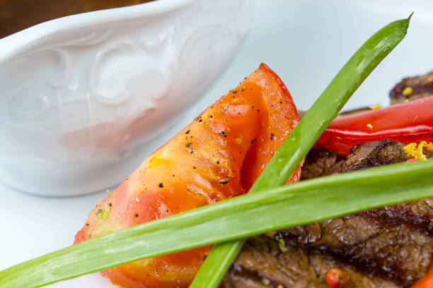 Grilled meat with vegetables and sauce