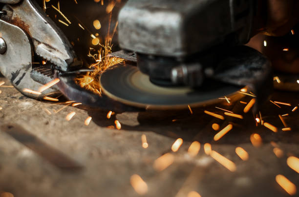 istock Hand of man with steel cutter tool blurred on black background 861008442