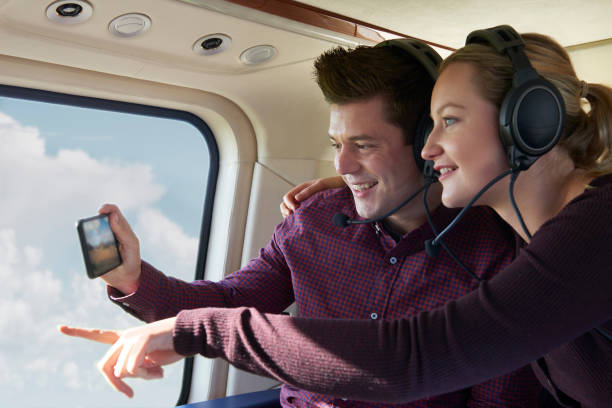 istock Couple On Vacation Taking Ride In Helicopter 861012794
