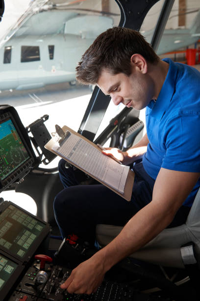 istock Male Aero Engineer With Clipboard Working In Helicopter Cockpit 861012902