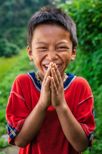 istock Happy Nepali boy saying Namaste near Annapurna Range 861016148