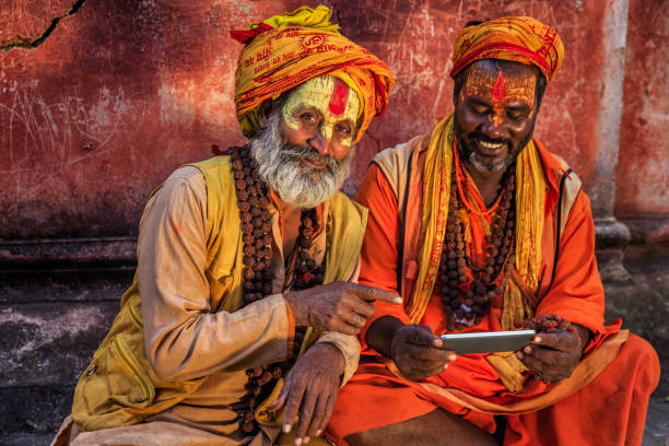 istock Sadhu - indian holymen using mobile phone 861018388