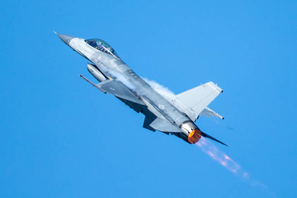 istock F-16 Fighting Falcon flying away, with afterburner on 861018856