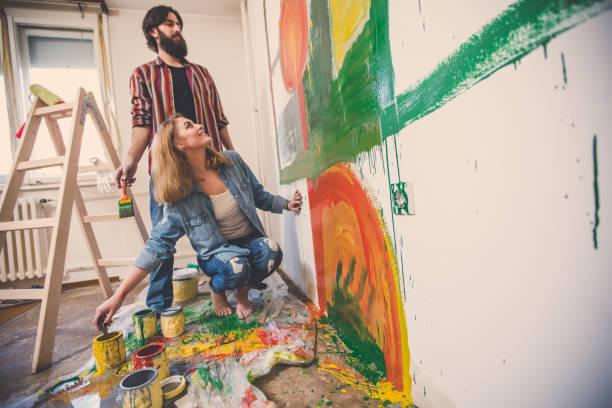 istock Cute couple painting together 861019294