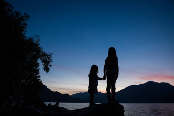 istock Sisters bonding by the sea 861019448