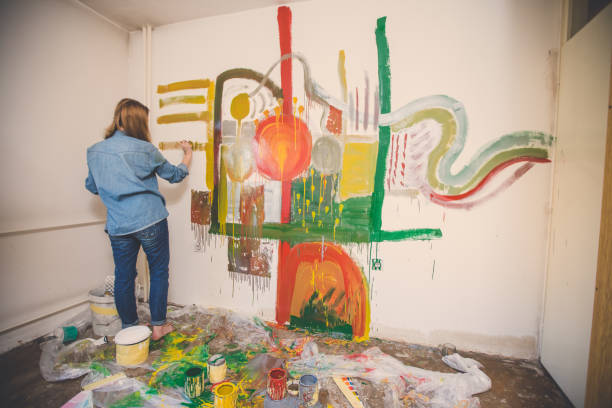 istock Woman painting alone at home 861019516