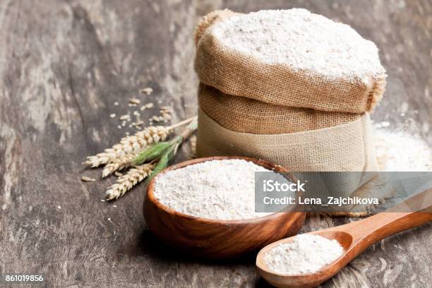 Whole Grain Flour In A Wooden Bowl And Sackcloth Bagwith Ears Stock Photo - Download Image Now