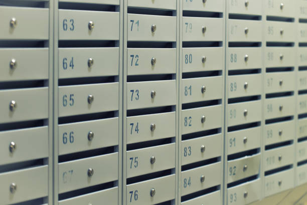 istock Many posting metal mailboxes with room number at residential building 861022706