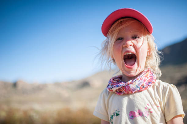 istock Happy Girl making faces having fun in nature 861025942