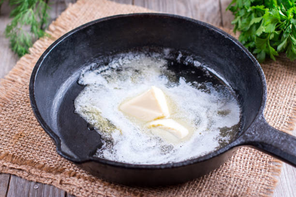 istock Piece of butter while melting in frying pan 861026096