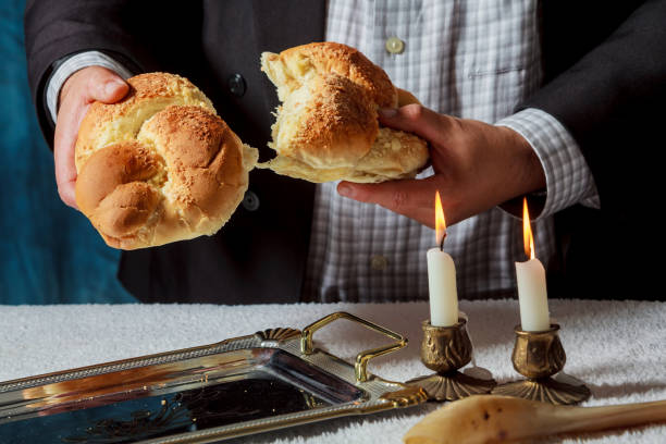 istock Sabbath challahs candlesticks with lit candles, and challah 861026226