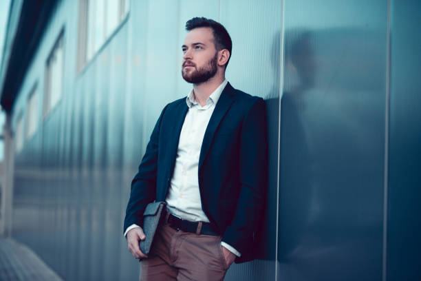 istock Young Handsome Businessman with Laptop Bag Posing After Work 861030668