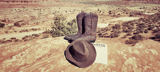 boots and hat at famous Monument Valley, USA