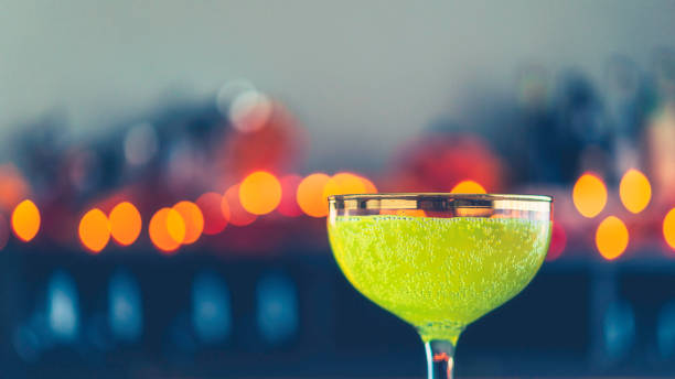 Halloween time. Lime green drink with bokeh background
