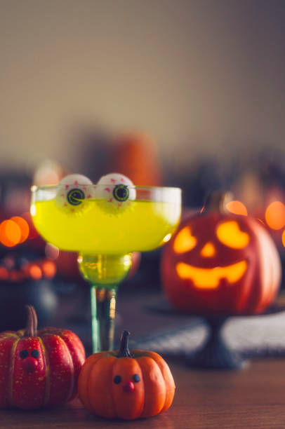 istock Halloween time. Lime green drink with eyeballs and Jack O'Lantern decorations 861037754