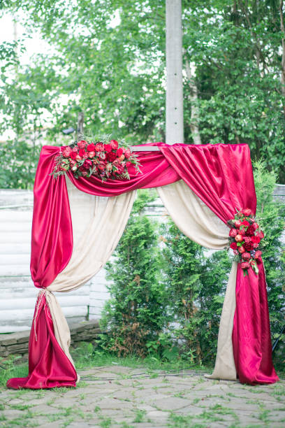 istock red coloured wedding arch for wedding ceremony 861040374