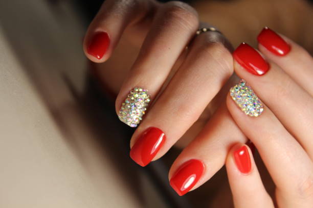 istock Manicure design is bright red and rhinestones 861041076