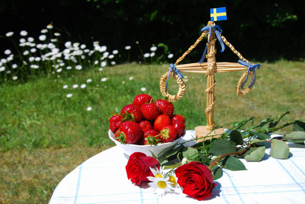 Table ready for swedish midsummer celebration stock photo