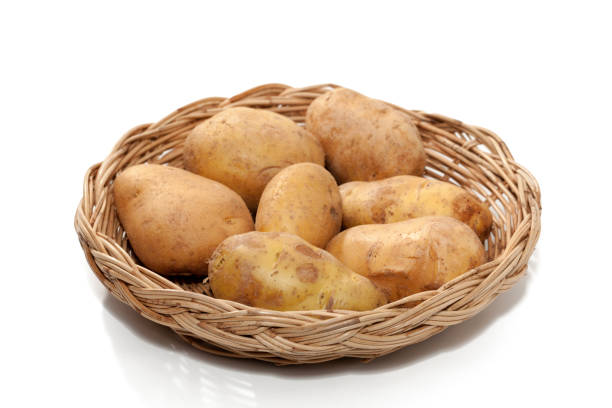 istock potato on basket isolated on white background 861049946