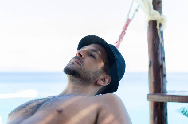istock Hipster dreamy man on the beach 861050920