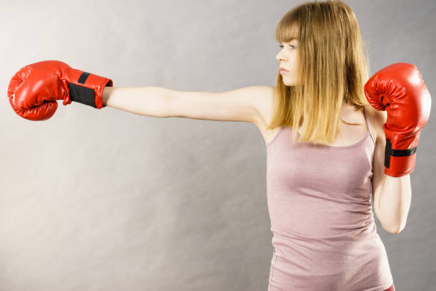 istock Woman wearing boxing gloves 861051242