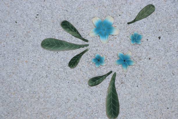 istock Clay blue flowers  with leaves pattern decorate on the wall 861057880