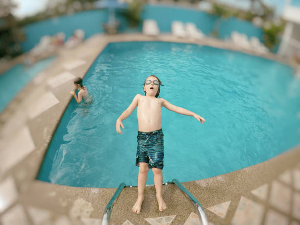 istock Child falling into a pool of water 861064426