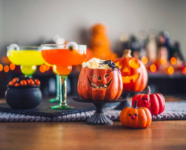 istock Halloween time. Vibrant colored drinks with cauldron of candy 861066706