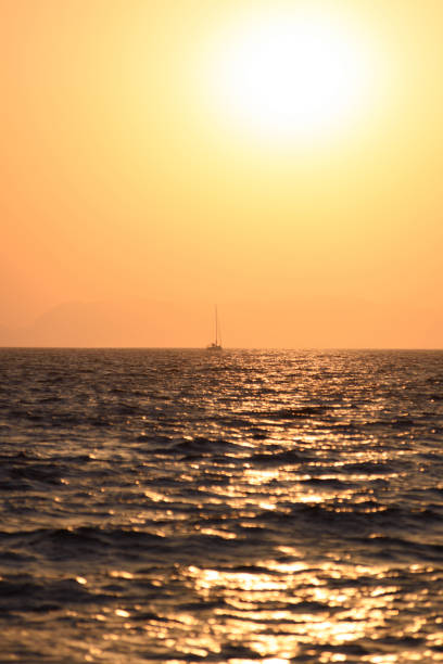 seascape scenic sunset with a boat. - bentham imagens e fotografias de stock