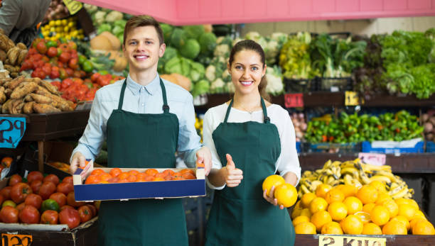 istock Supermarket workers selling fruits 861071094