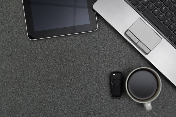 istock Laptop computer or notebook, notepad and cup of coffee on working table with copy space top view. 861072232