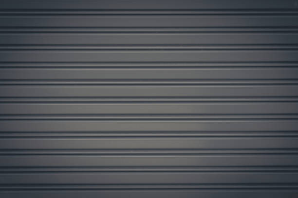 istock Gray metal roller shutter door or gate wall closed background and texture. 861072238