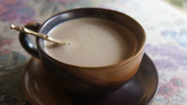 istock Cup of coffee (latte) on the table. Soft and vintage background. 861080254