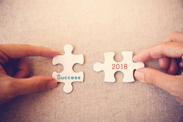 istock Hands with puzzle pieces and 