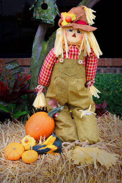 istock halloween strawman and pumpkins 861093196