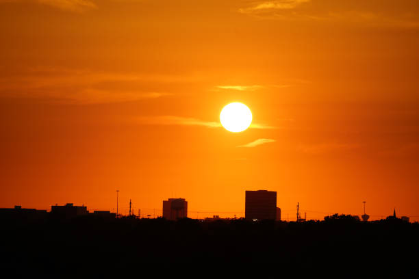 Colorful sunset over the flat skyline of Copenhagen, which do not have many skyscrapers. The picture is taken from the roof of a building in Ørestad which is a new and modern suburb to Copenhagen and placed on Kalvebod Commons - Kalvebod Fælled  which today is an important nature reserve for the capital of Denmark