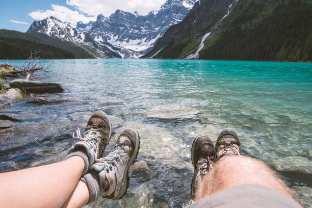 istock Personal perspective of hikers resting by the lake 861107346