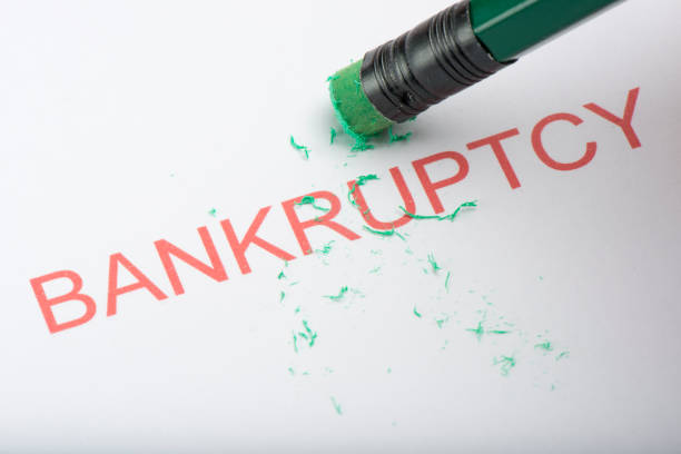 istock Pencil Erasing the Word 'Bankruptcy' on Paper 861108486