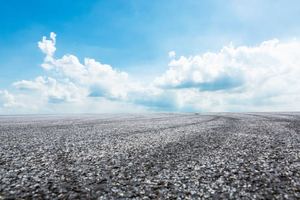 istock Asphalt road circuit and sky clouds with car tire brake 861111144