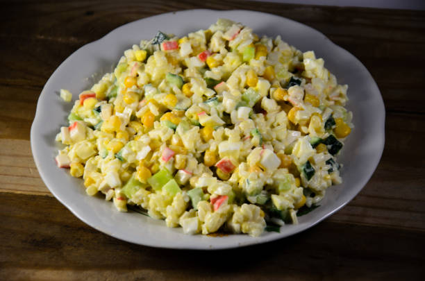 istock Salad with crab sticks, corn, cucumber, and eggs 861111344