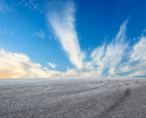 istock Asphalt road circuit and sky clouds with car tire brake 861111788
