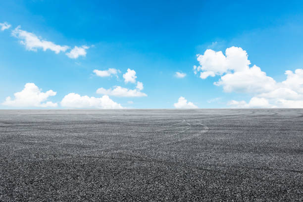 istock Asphalt road circuit and sky clouds with car tire brake 861114108