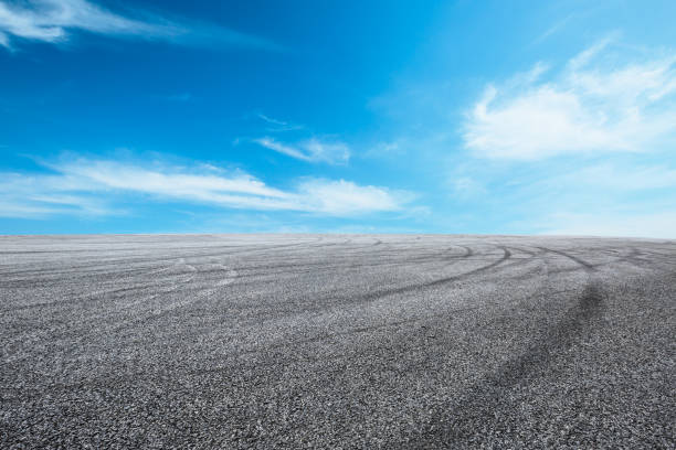 istock Asphalt road circuit and sky clouds with car tire brake 861114642