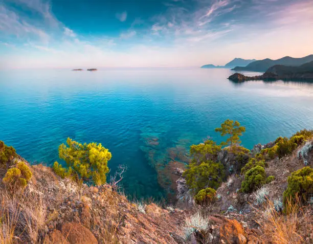 Picturesque Mediterranean seascape in Turkey. Colorful view of a small bay near the Tekirova village, District of Kemer, Antalya Province. Artistic style post processed photo.